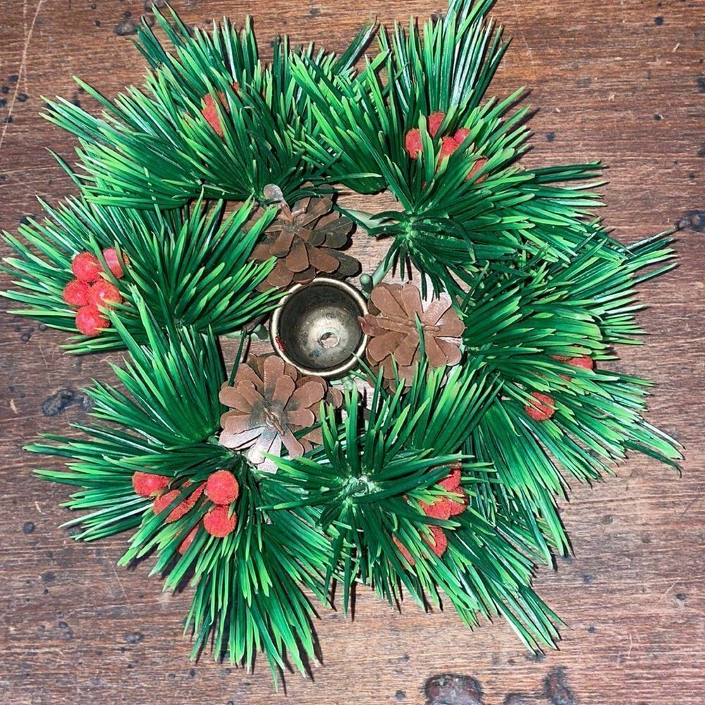 Vintage Christmas candle holder surrounded by pine‎ cones & holly berries